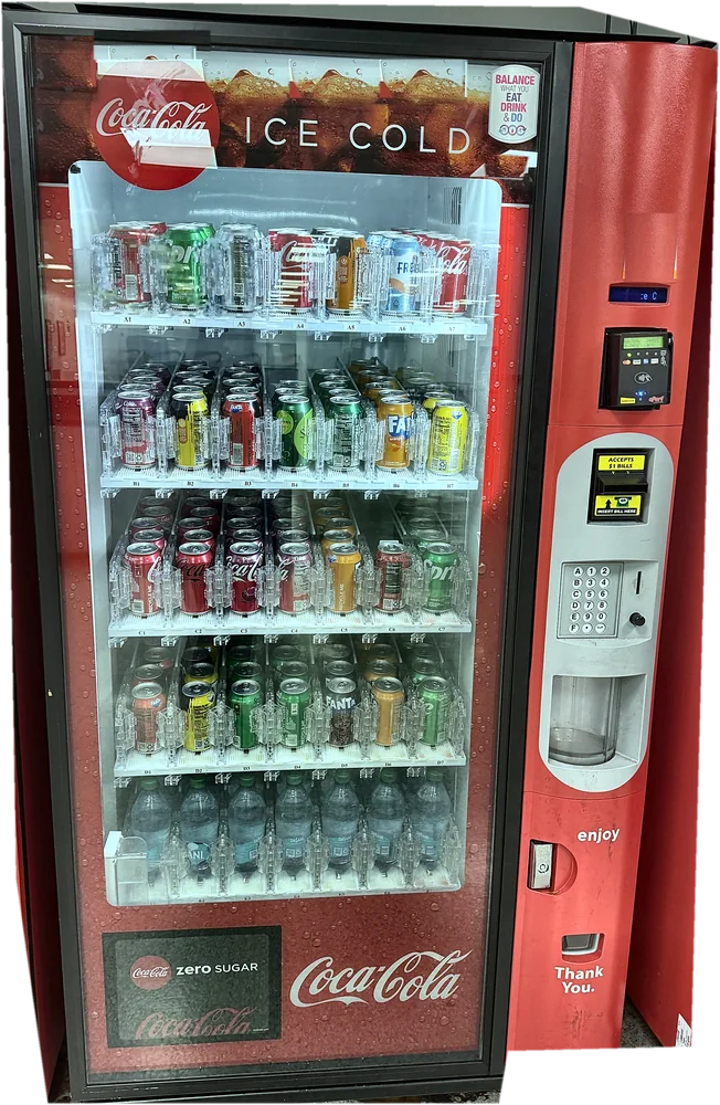 Coca-Cola machine with canned sodas and bottled water, accepting Apple Pay and cards.